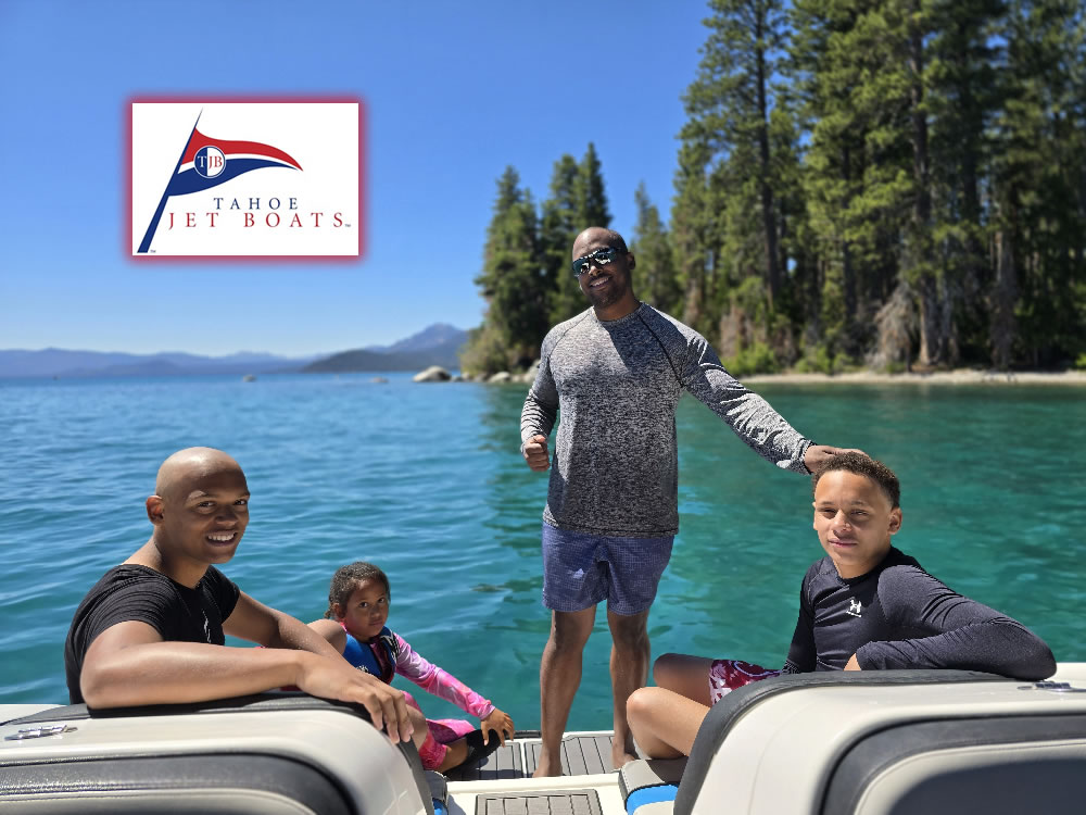 Propeller-free jet boat charter on Lake Tahoe with captain and passengers relaxing on turquoise water